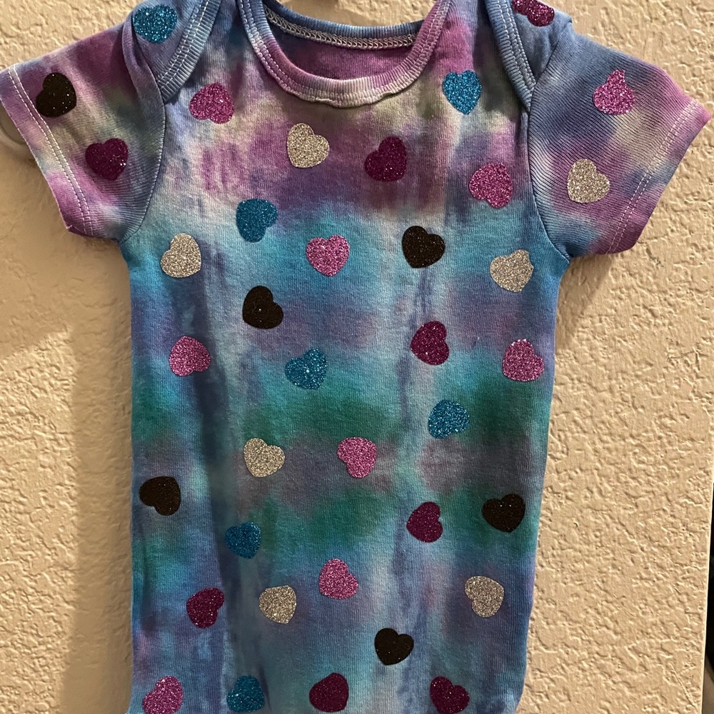 Hand tie dyed baby onesie